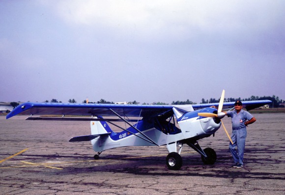 Ray standing besides his plane, Lihiniya